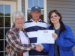 Marie Smith Presents Certificate to FOCAS